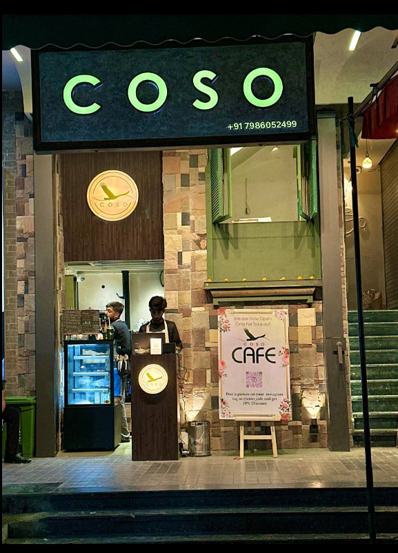 COSO Cafe storefront by night